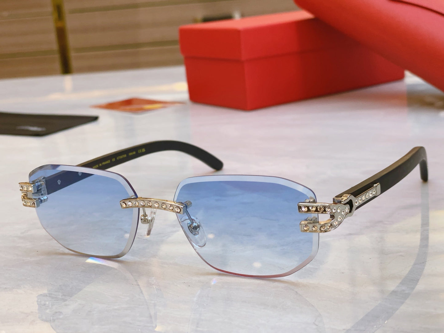High end diamond studded sunglasses paired with wooden legs