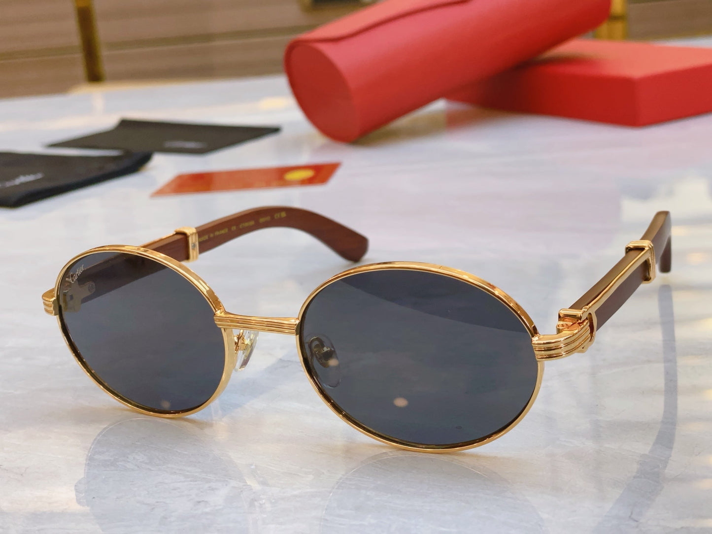 High end oval sunglasses with gold frame