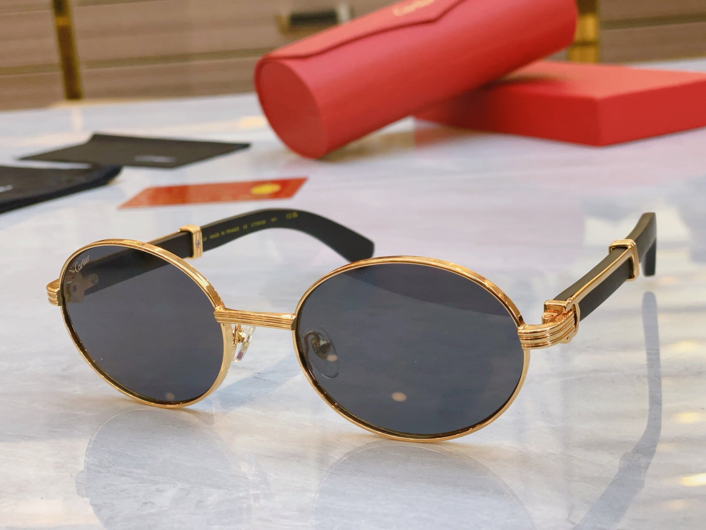 High end oval sunglasses with gold frame