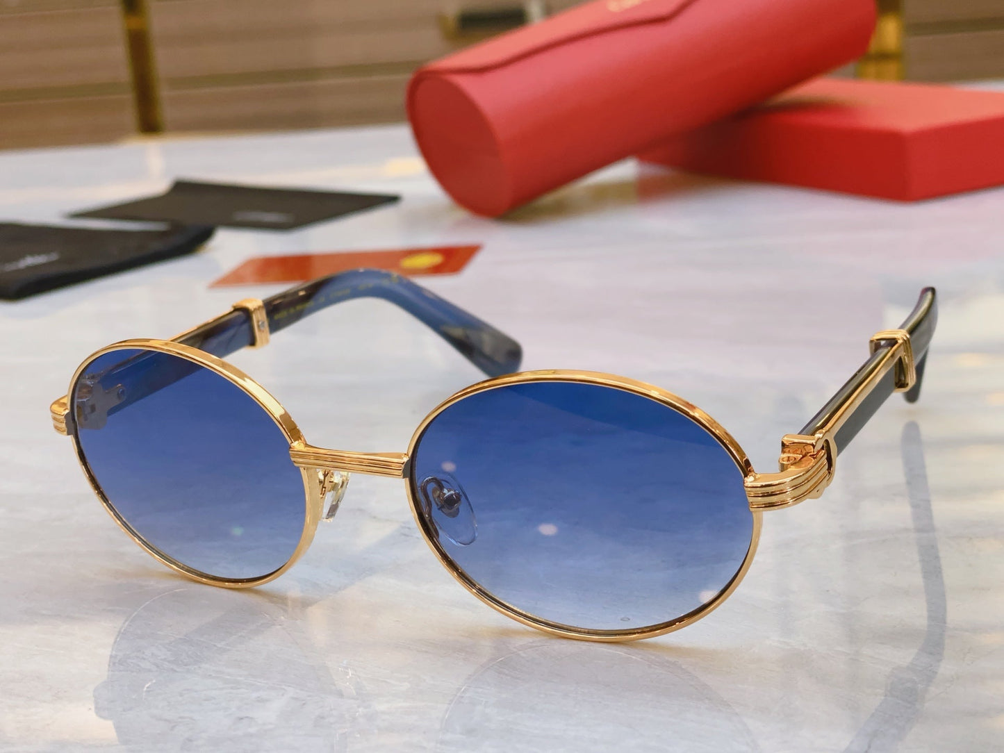 High end oval sunglasses with gold frame
