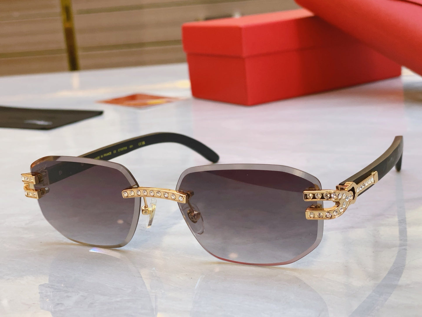 High end diamond studded sunglasses paired with wooden legs